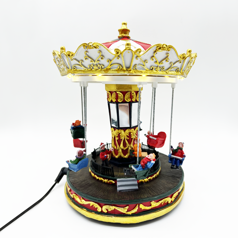 x0336.png ACA Lighting X0336 LED декор топла светлина коледно селище – въртящ се карусел + музика бат. 3×AA 20.5×20.5×25.5см